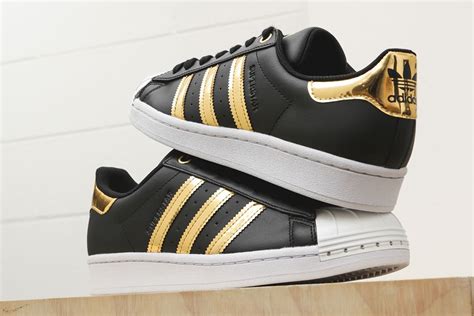 adidas sneakers gold stripes.